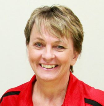 community service: Mary Ingram (headshot), founder of Volunteer Nebraska, smiling woman with short light brown hair, red and black top