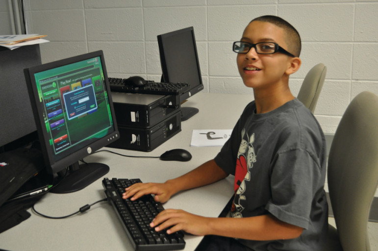 A summer program student gets ready to use the DimensionM math video game for math practice at the University of Hartford.