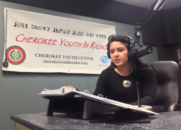 Madison Crowe reads from a script at the Cherokee Youth in Radio studio. She came through the program four years ago and says it’s helped her develop her voice.
