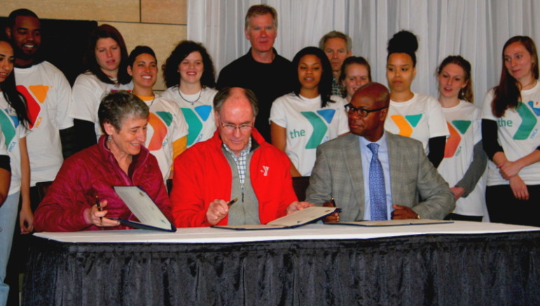 Secretary Jewell and YMCA President and CEO Neil Nicoll sign the agreement.