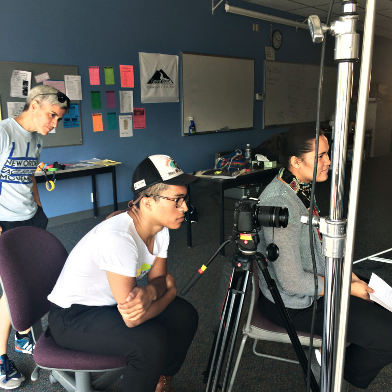 Eben-Ezer Yanez (center) and Freda Crichton (right) work with filmmaker Angie Bernadoni (left) from Reel Grrls on videos featuring stories of young people. The You Tube-style videos will provide information about local programs helping young adults return to school or get on a path to a job.