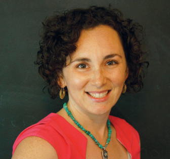 Stephanie Malia Krauss (headshot), director of special projects at Jobs for the Future, smiling woman with short, brown curly hair, earrings, necklace, red top