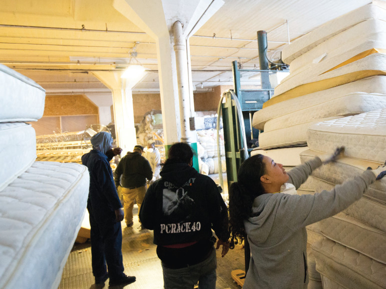 A job at the mattress plant is the first step in a rehabilitation program that brings youth into the workforce.