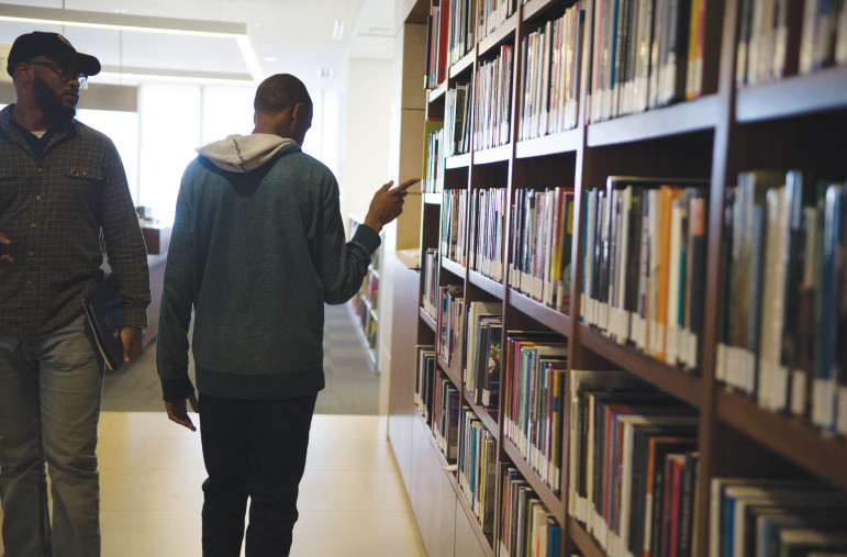 Emmit, browsing the library at Loyola Marymount University.