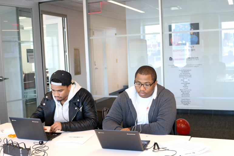 April 30, 2016 New York, NY-(from left to right) Mikale Jackson and Stephon Harper work on their laptop computers during a break session at the tech summit hosted by The New York Foundling. 