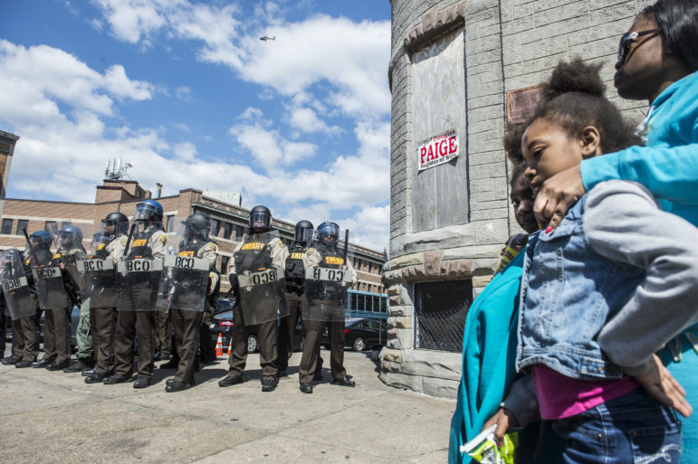 Large number of protestors were out in the streets Tuesday afternoon to protest the death of Freddie Gray, who was killed while in police custody one day after his funeral. residents stood near a line of riot police along W. North Avenue Tuesday afternoon.