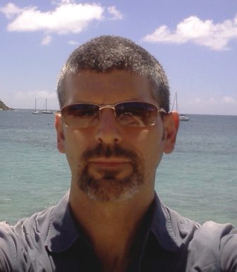 Josh Mackie headshot with ocean background
