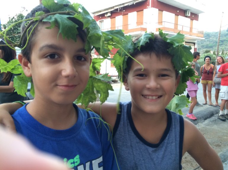 Community organizations on Skopelos Island in Greece are are addressing what they see is a gap in the country's education system -- lack of art and music -- as well as a disappearance of older art forms and practices. Here, kids wearing grape leaves take part in a program by the Sporades Islands Center for Sustainable Life. 