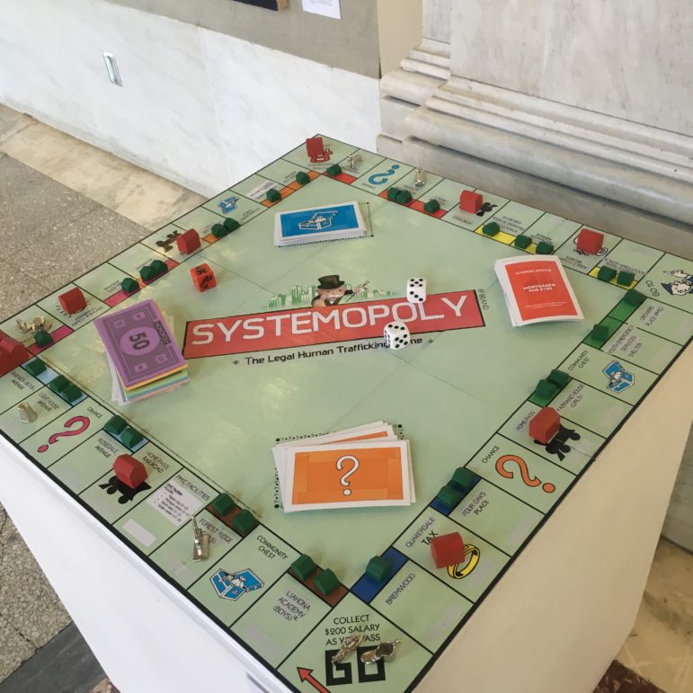 "Systemopoly" An artwork displayed at ArtForceIowa's annual KNOWJUSTICE exhibit; a completely redesigned Monopoly game that reflects the reality of a youth in the foster care system.