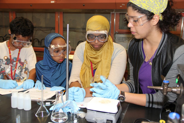 A week-long visit to the University of Minnesota is part of the 4-H STEM program. Here, students visit a chemistry lab at the university.