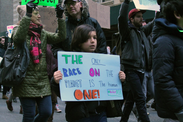 A child marches in Manhattan on Sunday, January 29, 2017 to protest Trump’s executive order on immigration and to demand the immediate release of all travelers detained as a result of the order. 