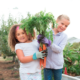 youth educational edible garden grants; two young girls in garden with freshly harvested carrots