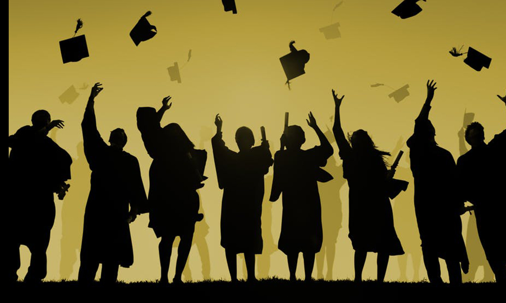 Foster care: Silhouettes of graduates throwing their mortarboards into the air.