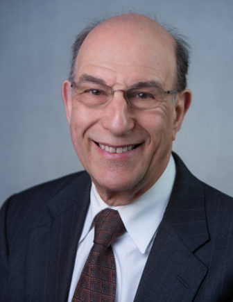 University of California at Berkeley professor Richard Rothstein (headshot), smiling partly bald man in glasses, dark jacket, patterned tie, light blue shirt