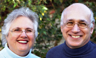 Paula Litt (headshot) on right, who is on board of Liberty Hill Foundation, smiling with short gray hair, glasses, lipstick, wearing light blue turtleneck; Barry Litt (headshot) a prominent civil rights attorney for 48 years, smiling with short gray hair, glasses, wearing dark blue turtleneck.