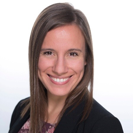 Molly Rivera (headshot), board chair of the Young Nonprofit Professionals Network of the Triangle and communication associate at the American Civil Liberties Union of North Carolina, smiling young woman with long brown hair, dark jacket.