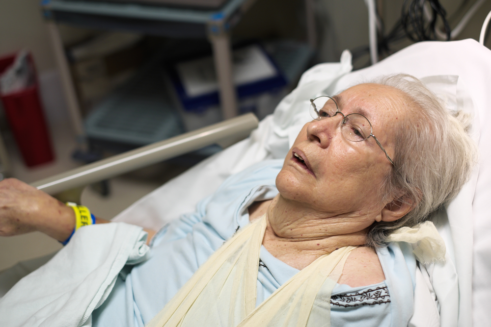Restorative justice: Elderly 80 plus year old woman in a hospital bed.