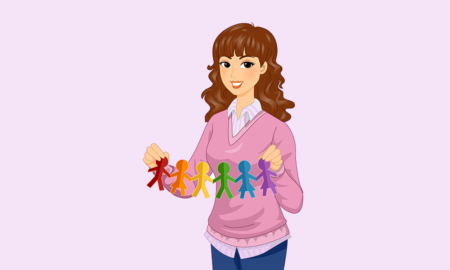 Mentoring: Smiling female Teacher Showing Paper Dolls in Rainbow Colors as support for LGBT