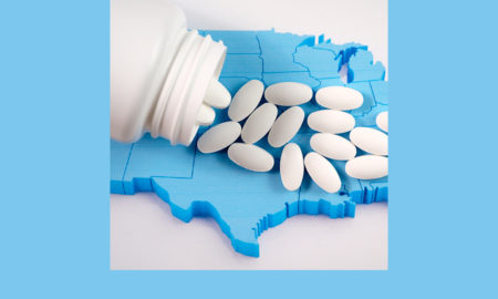 Foster care: White prescription pharmaceutical pills on map of United States