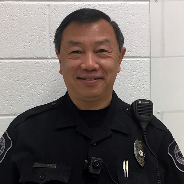 SRO: Jerry Quan (headshot), Cobb County (Georgia) School Resource Officer, smiling man in dark blue uniform