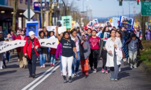 community organizing, social justice and change grants: group of protestors marching down street