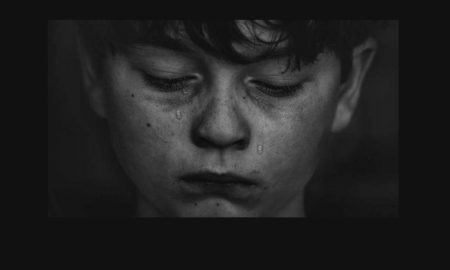 Stress: Close-up of boy with tears on face.
