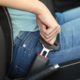 teen driving safety grants; teen buckling seatbelt close-up