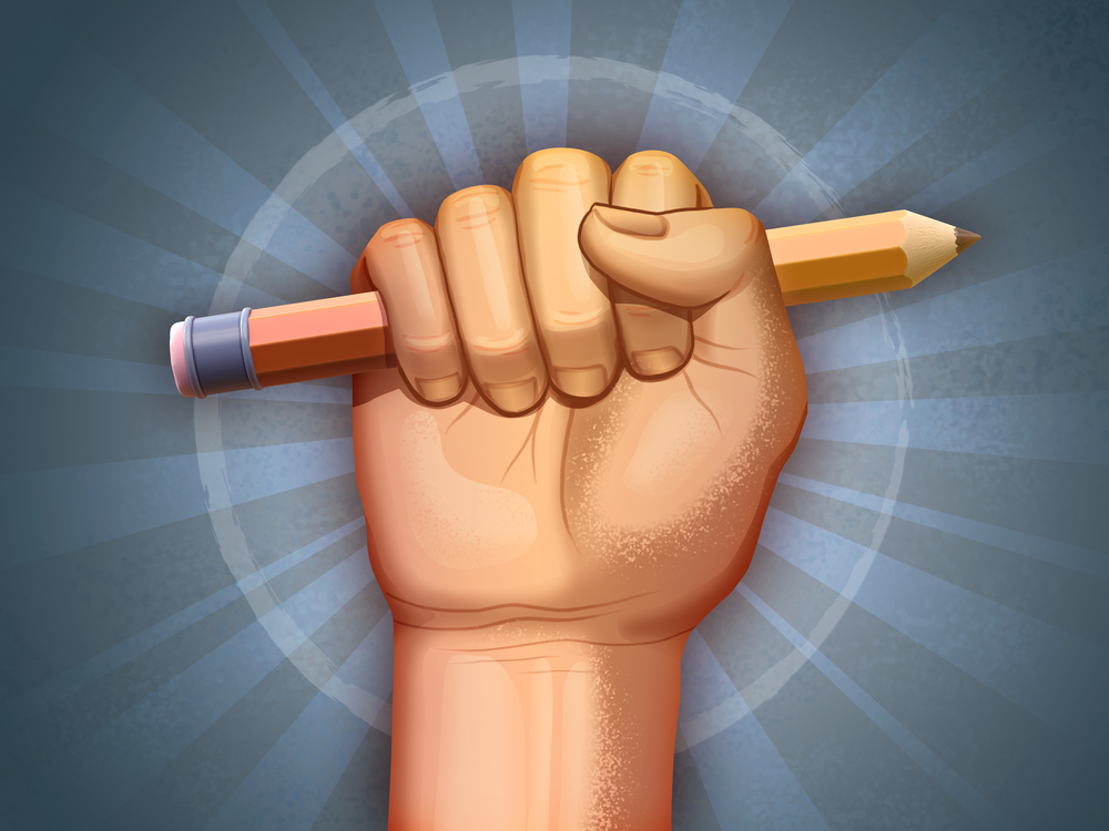 Free press: Fist holding a pencil as a symbol of freedom.