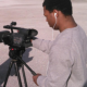 Student Reporting Labs: Young man operates videocam