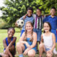 summer camp: portrait of 6 children with soccer outside.
