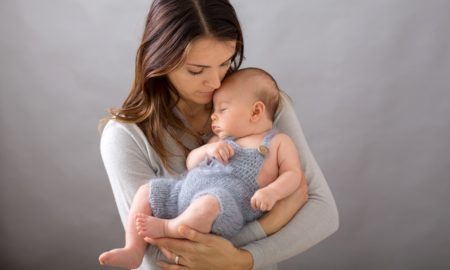 teen parenting and mental health grants; young mother holding baby