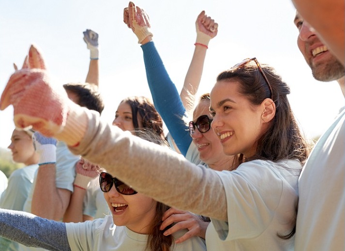 community grant, community development grants, environmental project grants: happy volunteer women giving thumbs up