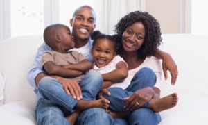 at-risk children, youth and families: child and family support program grants; happy family on couch