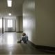 child abuse and neglect prevention, treatment grants; sad child sitting in hallway