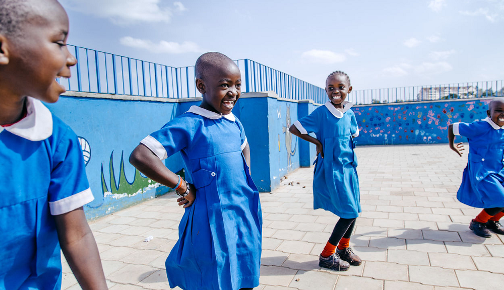 humanitarian organization prize; young happy children dancing