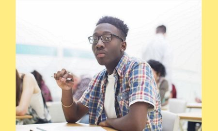 black lgbtq mental health report; young gay black male in school classroom