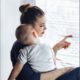 teen/young parent services program grants; young mother with child looking out window
