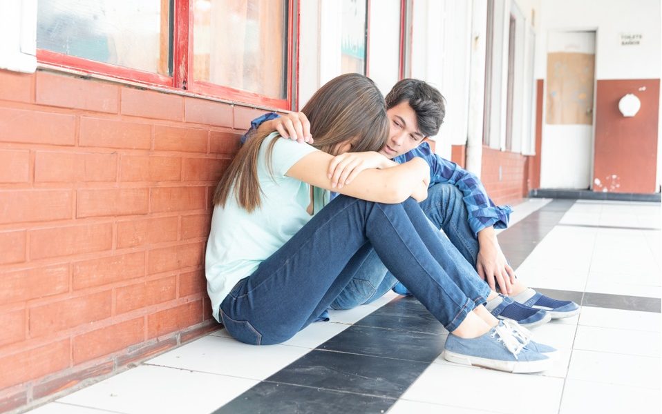 conflict resolution, inclusion, anti-hate and anti-bullying grants; teen comforting other teen at school