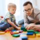 early childhood welfare and family support program grants; child and father playing on floor