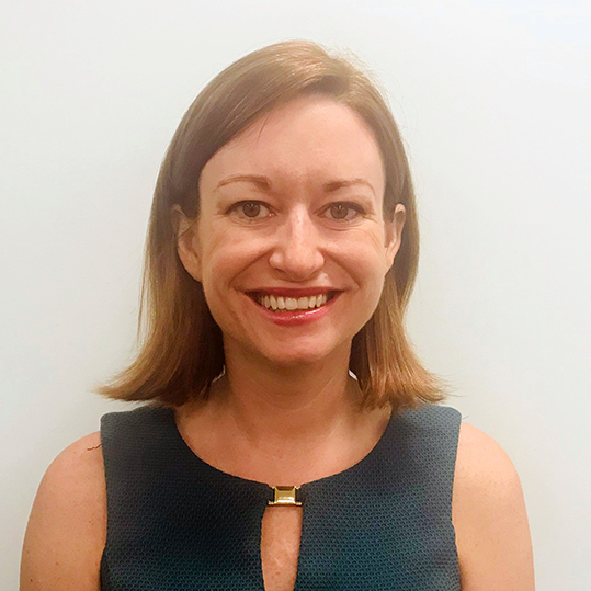 TAG: Katie Napolitano (headshot), consultant for Graham SLAM program at Graham Windham, smiling woman in dark green top 