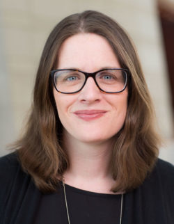 Michelle Shumate (headshot), professor at Northwestern University, woman with glasses, necklace, dark top