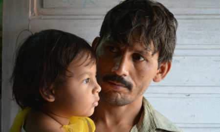 foster care: Worried-looking father with his small daughter.