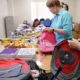 CT community grants; volunteers packing bags for students