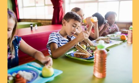 childhood hunger and food access grants; children eating food at table