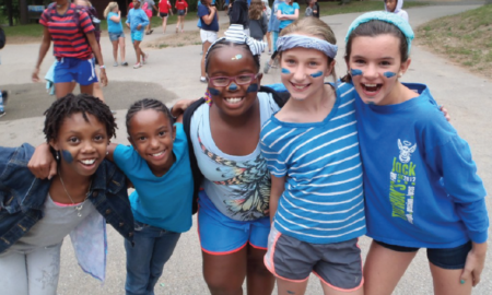 middle school out-of-school time learning program grants; happy young girls outside at program