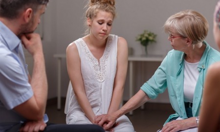 campus sexual/domestic/dating violence and stalking reduction grants; young female victim at therapy support session