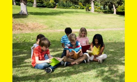prek-12 summer reading program grants; children reading outside in park