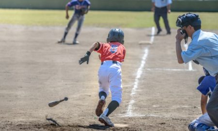 youth baseball/softball grants; youth player runs towards first base after hit
