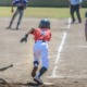 youth baseball/softball grants; youth player runs towards first base after hit