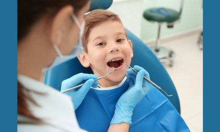 youth oral healthcare access grants; happy young boy at dentist's office